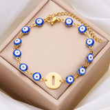 Women's High-grade Stainless Steel Blue Eyes Fashion Hollowed-out 26 Letter Bracelet