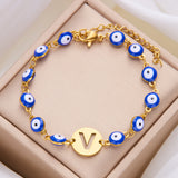 Women's High-grade Stainless Steel Blue Eyes Fashion Hollowed-out 26 Letter Bracelet