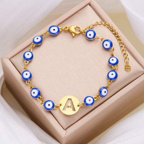 Women's High-grade Stainless Steel Blue Eyes Fashion Hollowed-out 26 Letter Bracelet