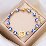 Women's High-grade Stainless Steel Blue Eyes Fashion Hollowed-out 26 Letter Bracelet